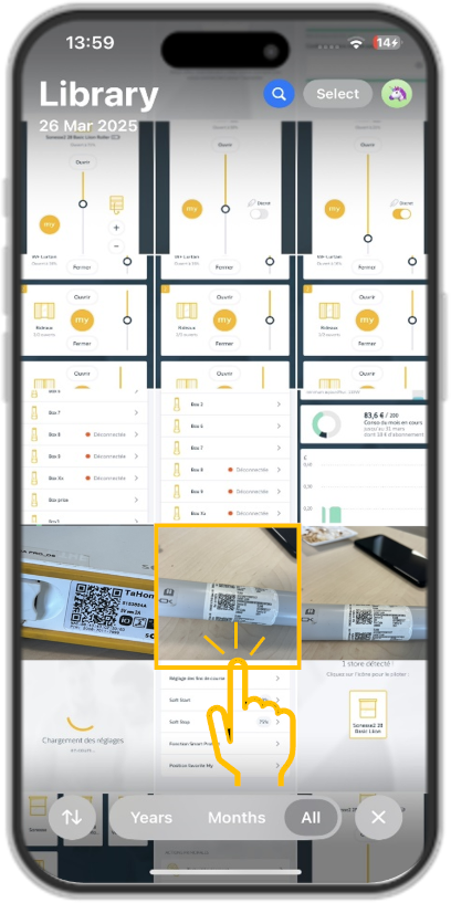 A mobile phone's image gallery full of pictures with a highlight around a picture of a motor's QR code.