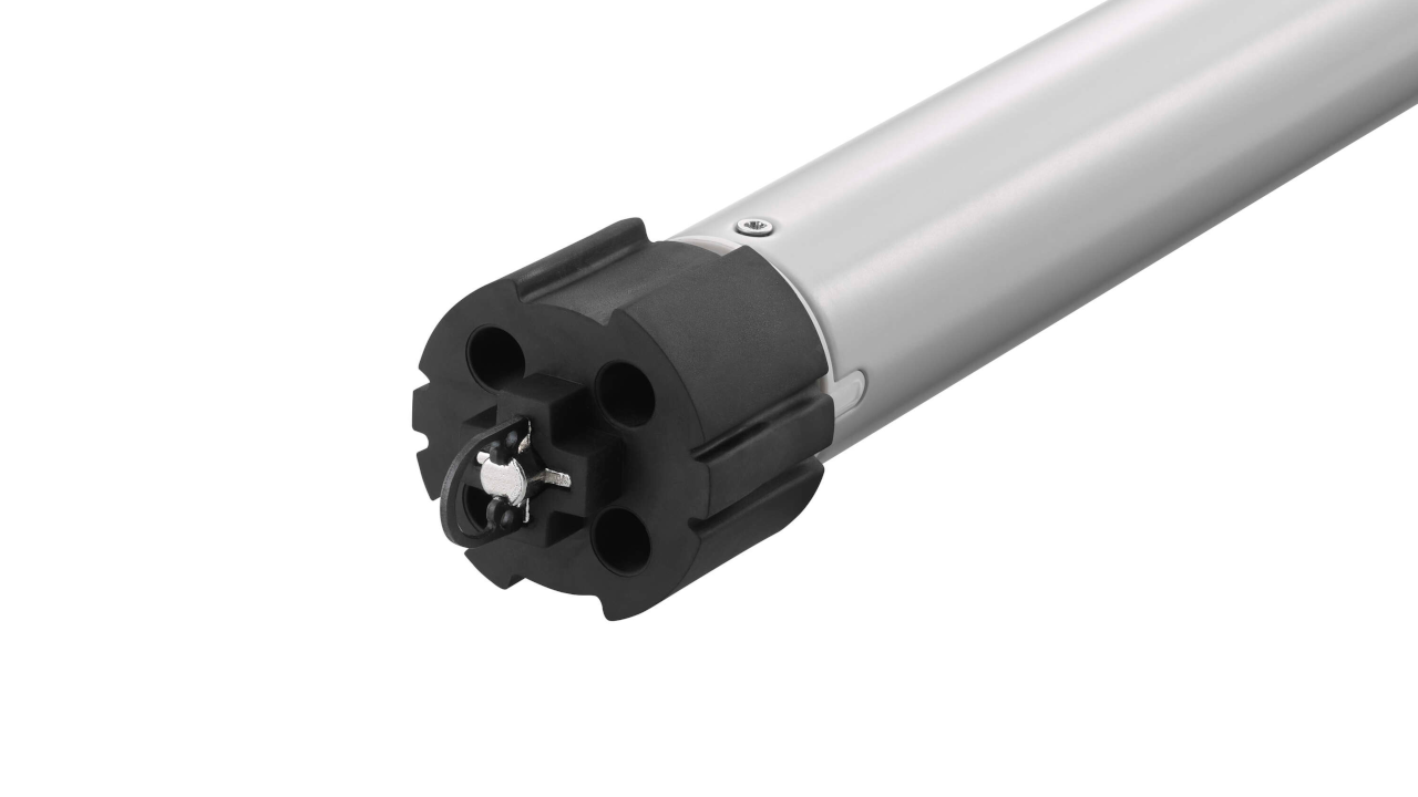 Somfy motor with the new D-ring and quick lock drive feature and 'Quick Lock Drive' text positioned next to it.