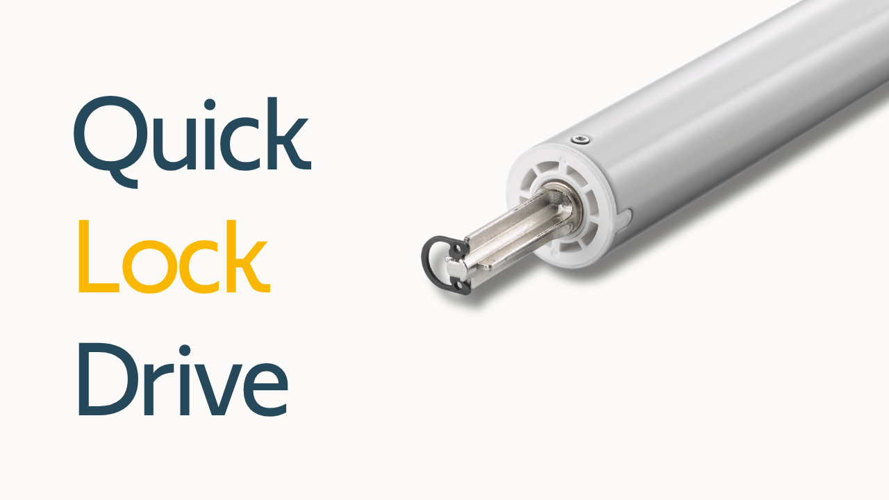 Somfy motor with the new D-ring and quick lock drive feature and 'Quick Lock Drive' text positioned next to it.